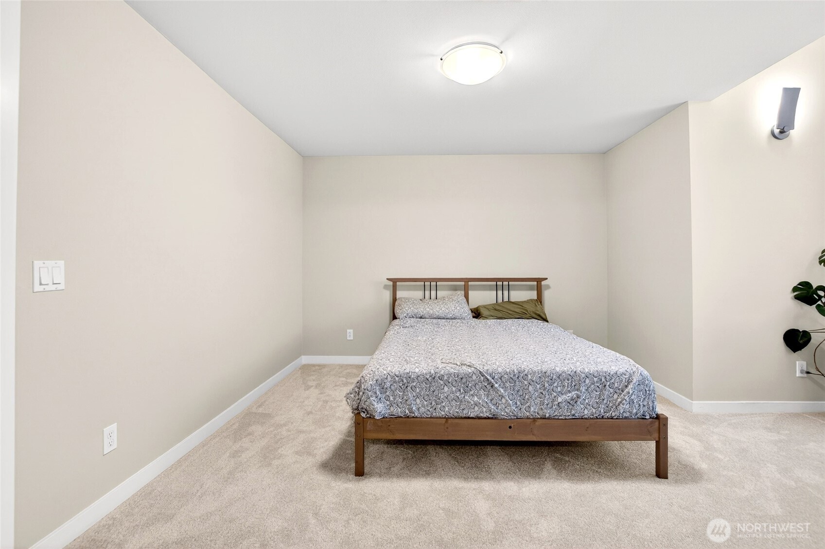 22925 79th Place West, Unit B Edmonds, WA 98026 - Photo 15 of 39 a bedroom with a bed and chair