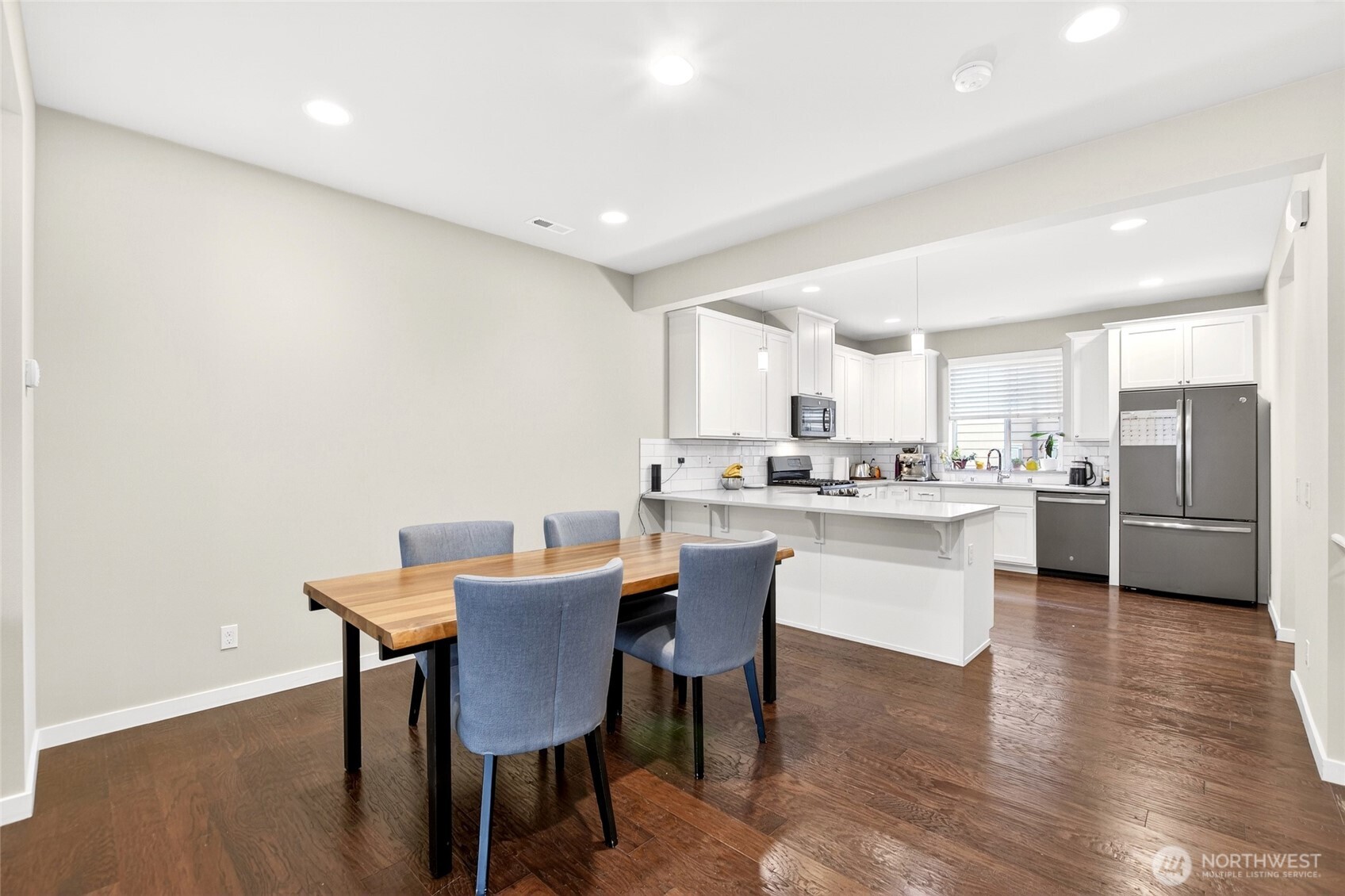 22925 79th Place West, Unit B Edmonds, WA 98026 - Photo 23 of 39 a kitchen with a dining table chairs and view living room