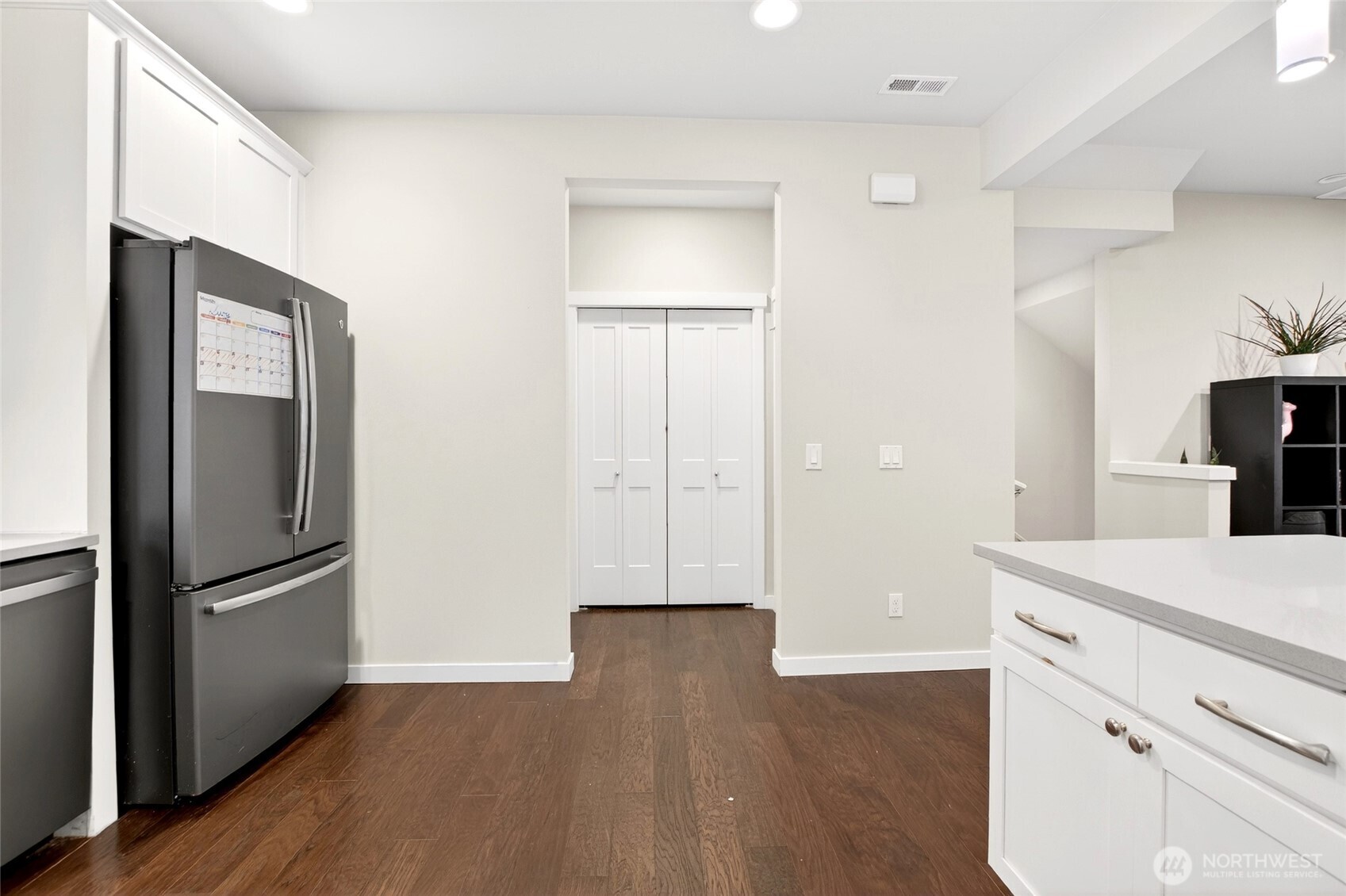 22925 79th Place West, Unit B Edmonds, WA 98026 - Photo 5 of 39 a kitchen with a refrigerator and a stove top oven