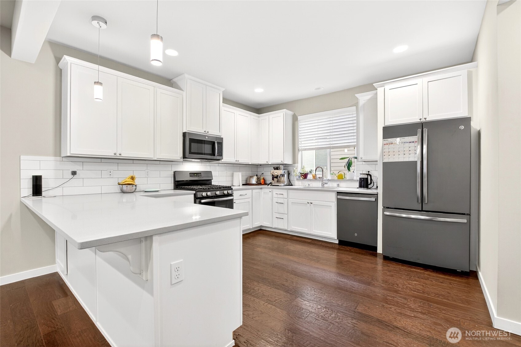 22925 79th Place West, Unit B Edmonds, WA 98026 - Photo 7 of 39 a kitchen with stainless steel appliances a refrigerator sink and microwave