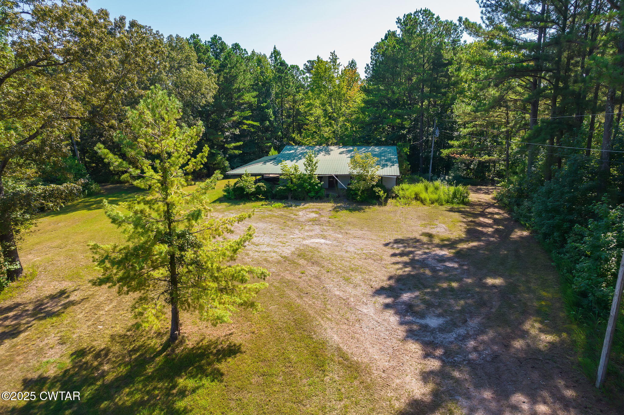 a pathway of a house with a yard