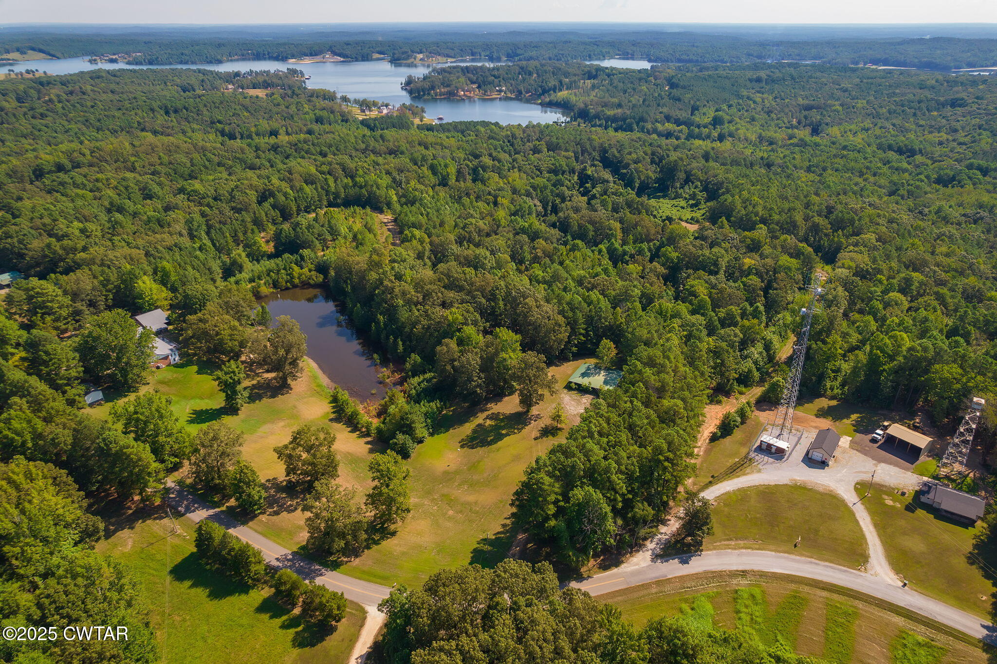 0 Leach Road Huntingdon, TN 38344 - Photo 29 of 30 an aerial view of residential house with outdoor space and trees all around