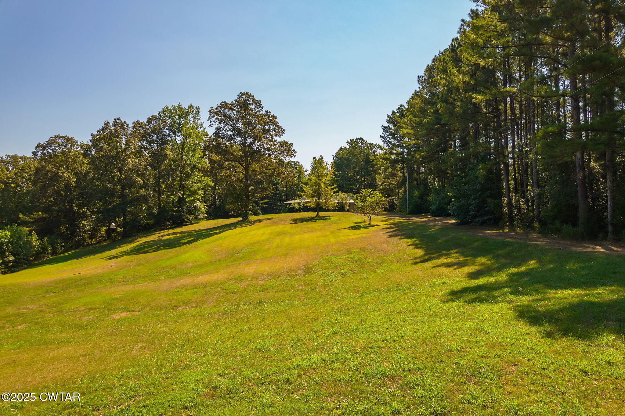 0 Leach Road Huntingdon, TN 38344 - Photo 3 of 30 a view of a swimming pool with an outdoor space and seating area