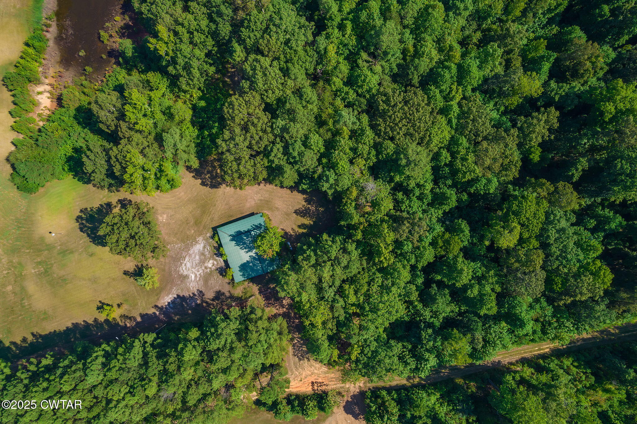0 Leach Road Huntingdon, TN 38344 - Photo 6 of 30 an aerial view of a house with a yard
