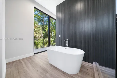 a bathroom with a bathtub and shower
