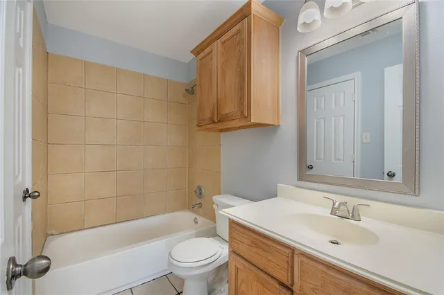 a bathroom with a sink a toilet and bathtub