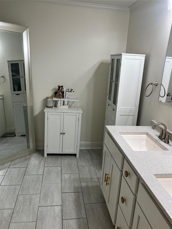 233 Church Road Stonewall, LA 71078 - Photo 18 of 32 Bathroom with double vanity, light tile patterned floors, and ornamental molding