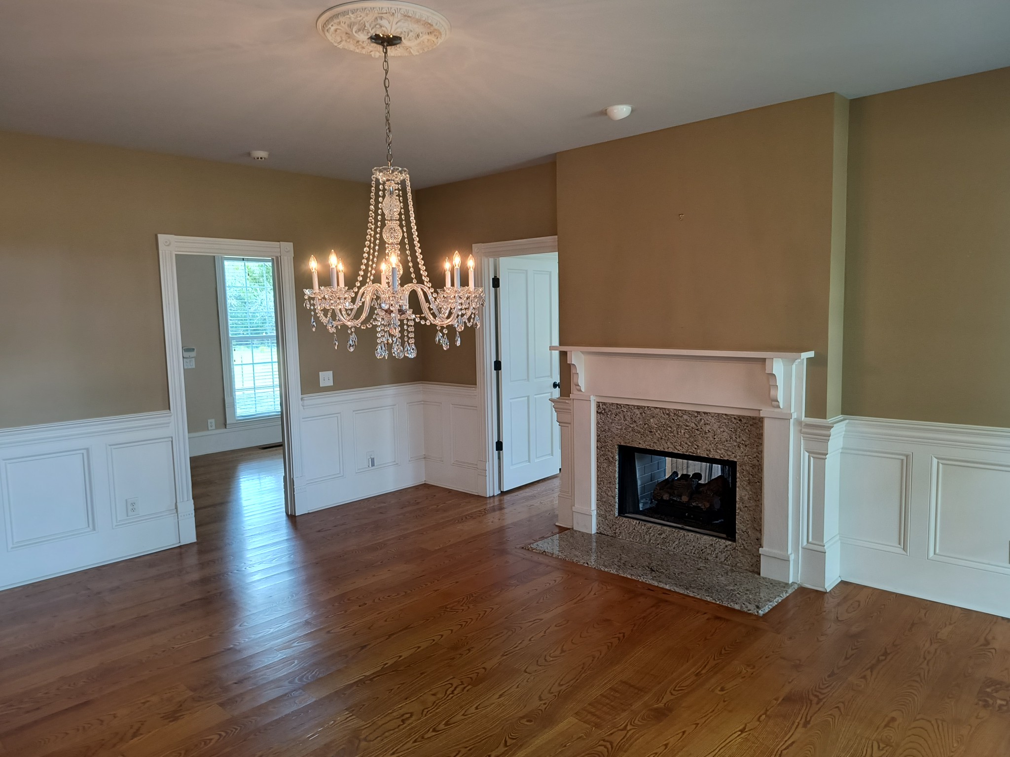 3460 Big Springs Road Lebanon, TN 37090 - Photo 17 of 74 a view of a livingroom with wooden floor a fireplace and windows