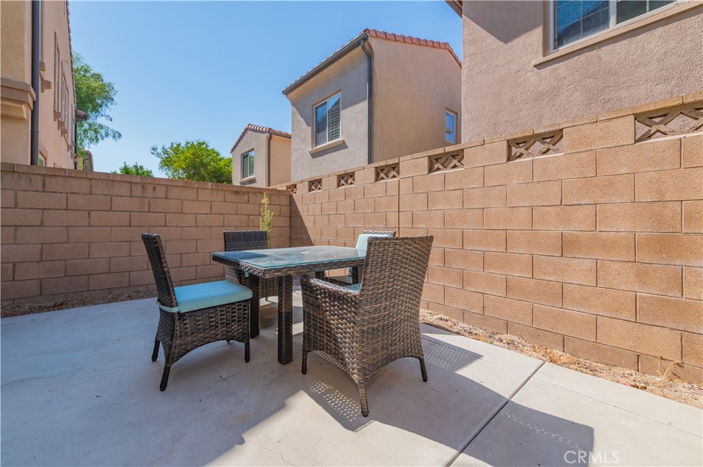 160 Pathway Irvine, CA 92618 - Photo 3 of 5 a view of a patio with table and chairs and potted plants