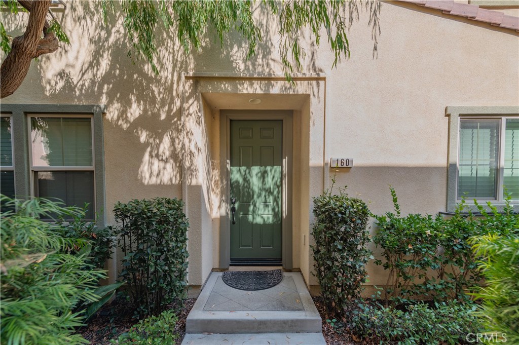 160 Pathway Irvine, CA 92618 - Photo 4 of 5 a front view of a house with garden