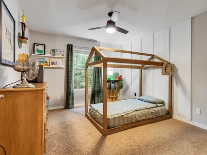 a bed room with a bed and a window