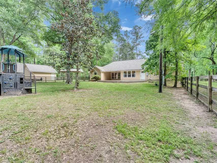 a view of a backyard with sitting area