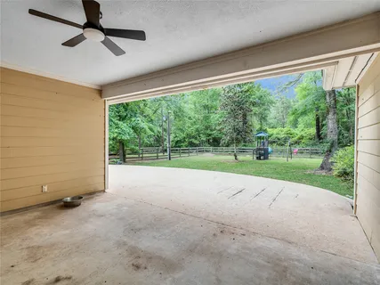 a view of a house with a yard and sitting area