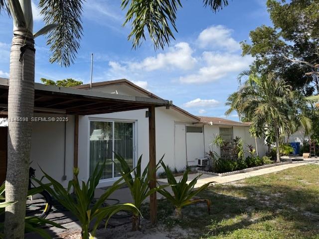 520 Southwest 62nd Avenue Margate, FL 33068 - Photo 12 of 34 a front view of a house with garden