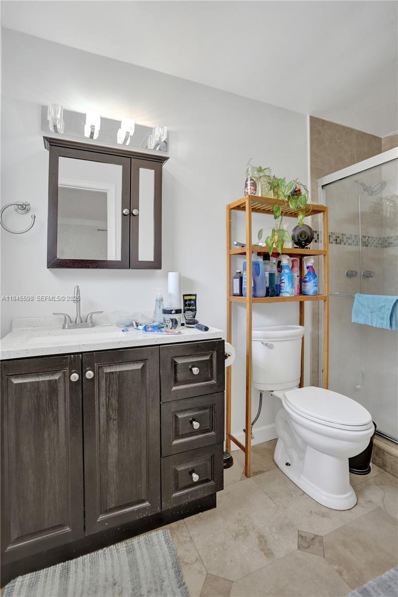 520 Southwest 62nd Avenue Margate, FL 33068 - Photo 15 of 34 a bathroom with a sink vanity mirror and toilet