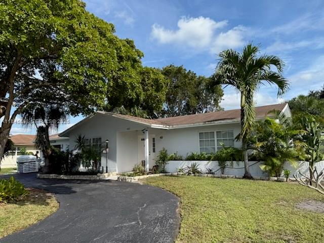 520 Southwest 62nd Avenue Margate, FL 33068 - Photo 2 of 34 a front view of a house with garden