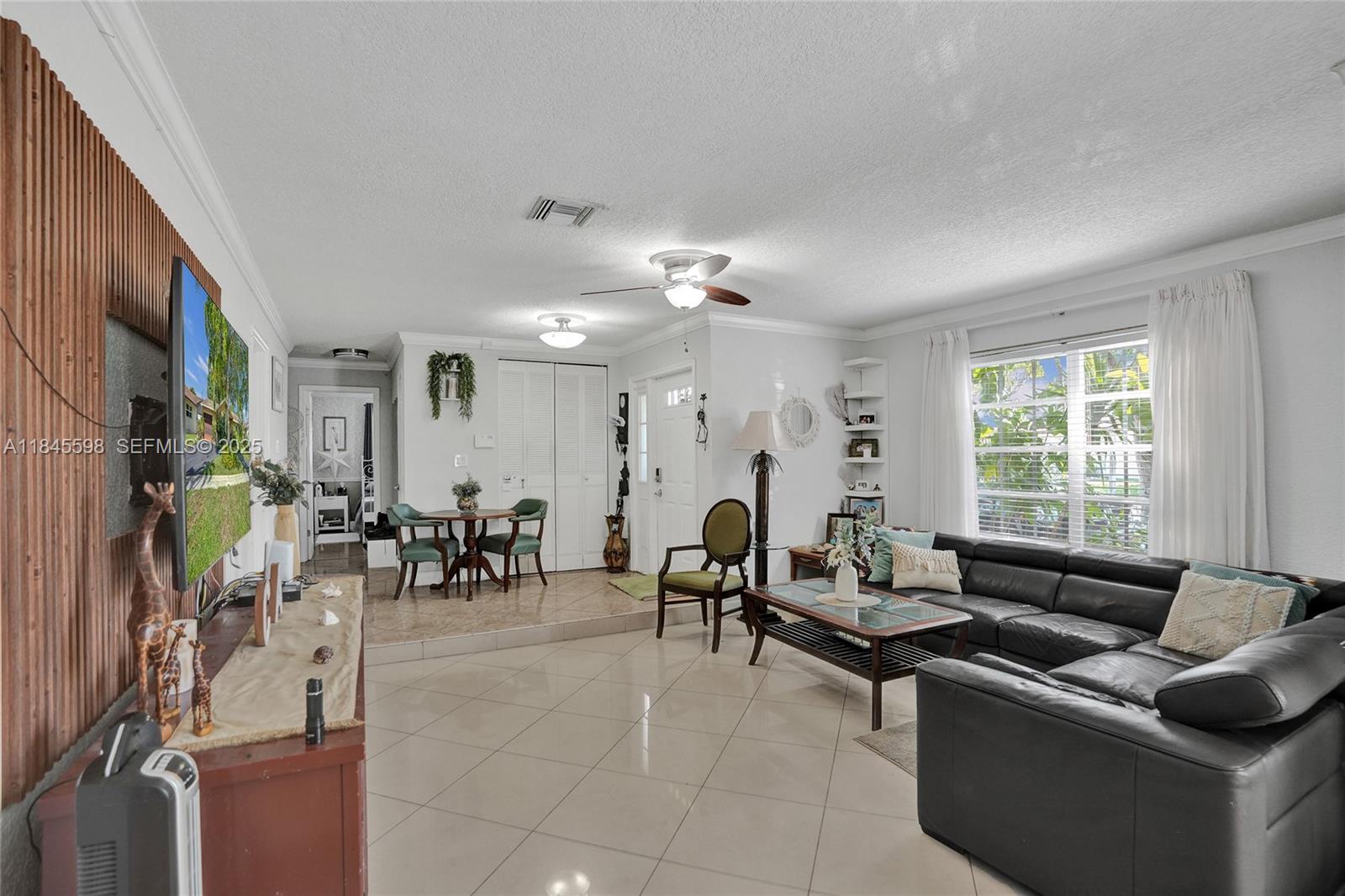 520 Southwest 62nd Avenue Margate, FL 33068 - Photo 26 of 34 a living room with furniture and a large window