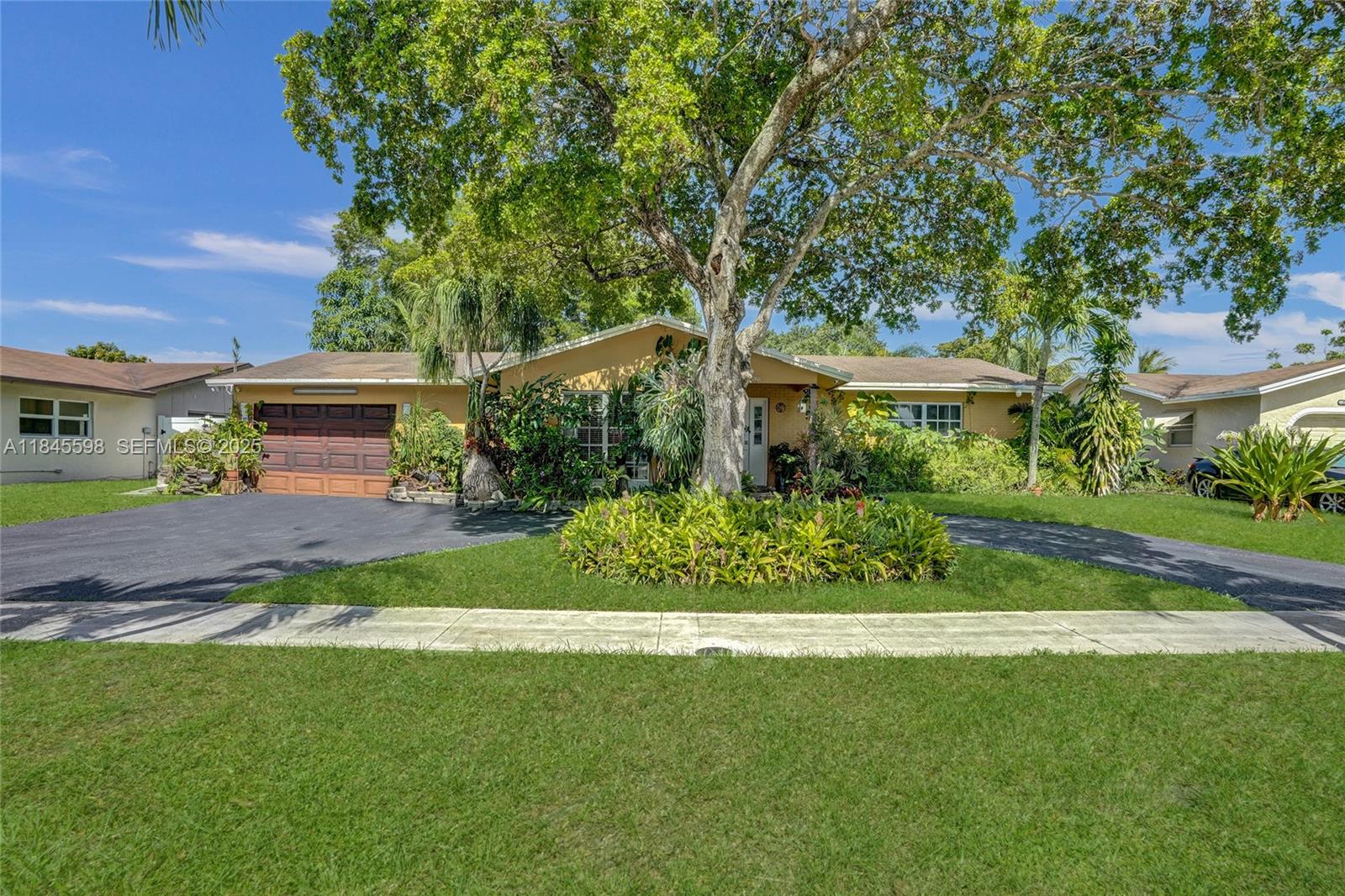 520 Southwest 62nd Avenue Margate, FL 33068 - Photo 29 of 34 a front view of a house with a yard
