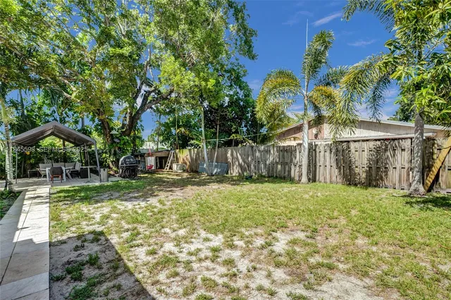 a backyard of a house with lots of green space