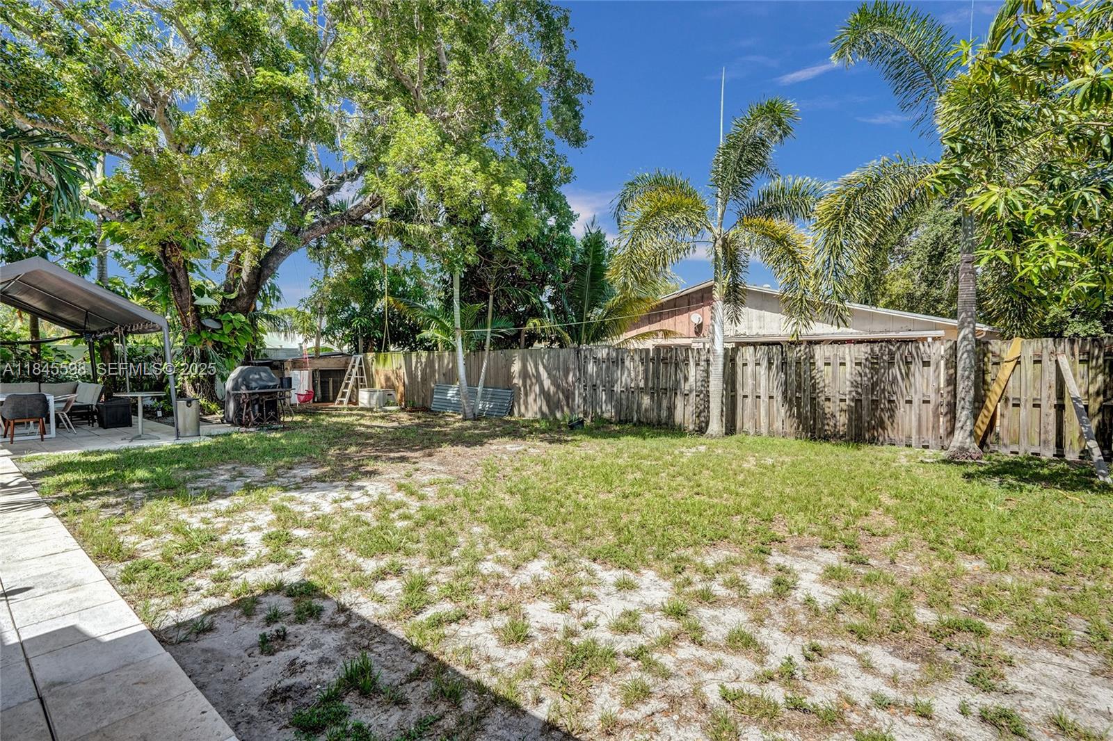 520 Southwest 62nd Avenue Margate, FL 33068 - Photo 33 of 34 a view of a house with backyard and a tree