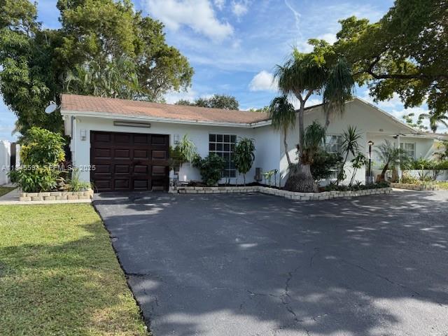 520 Southwest 62nd Avenue Margate, FL 33068 - Photo 6 of 34 a front view of a house with garden