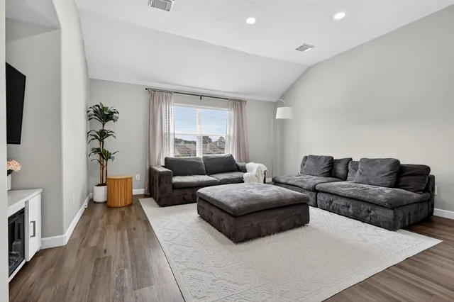 a bedroom with a bed and a couch