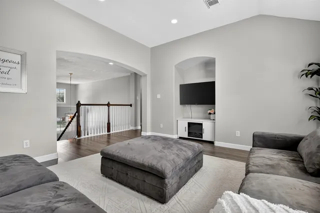 a view of work space with wooden floor and a window