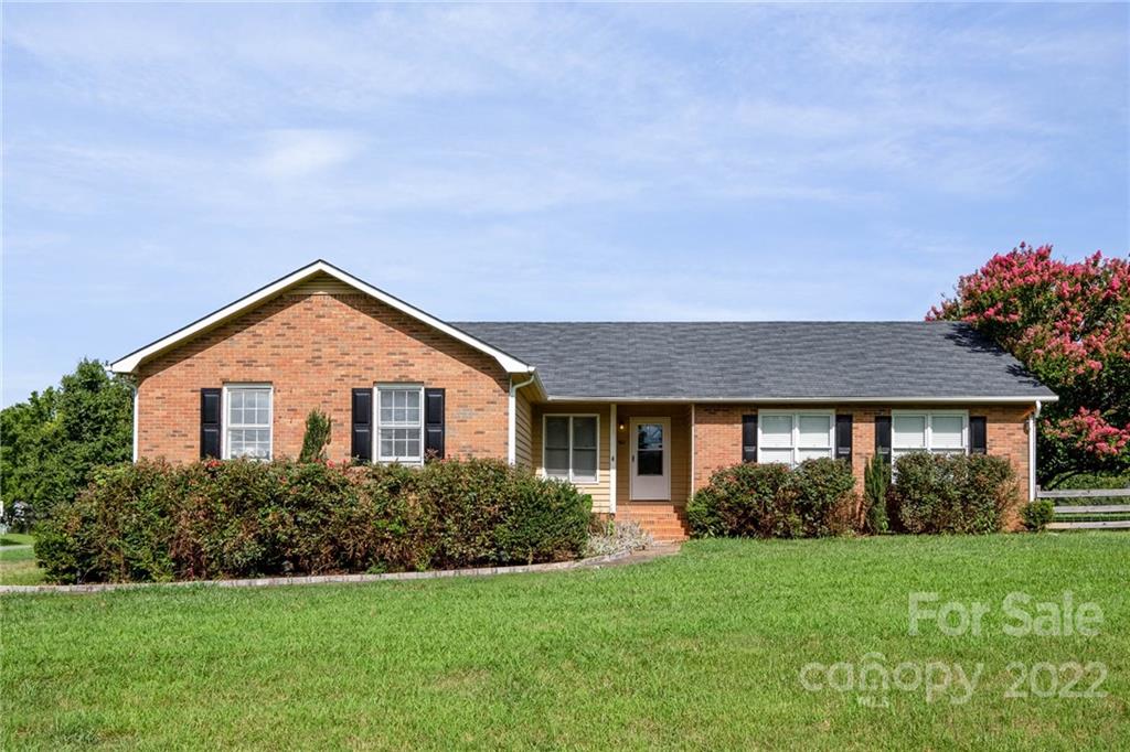 901 Stevens Road Monroe, NC 28110 - Photo 1 of 28 a front view of a house with a yard and garage