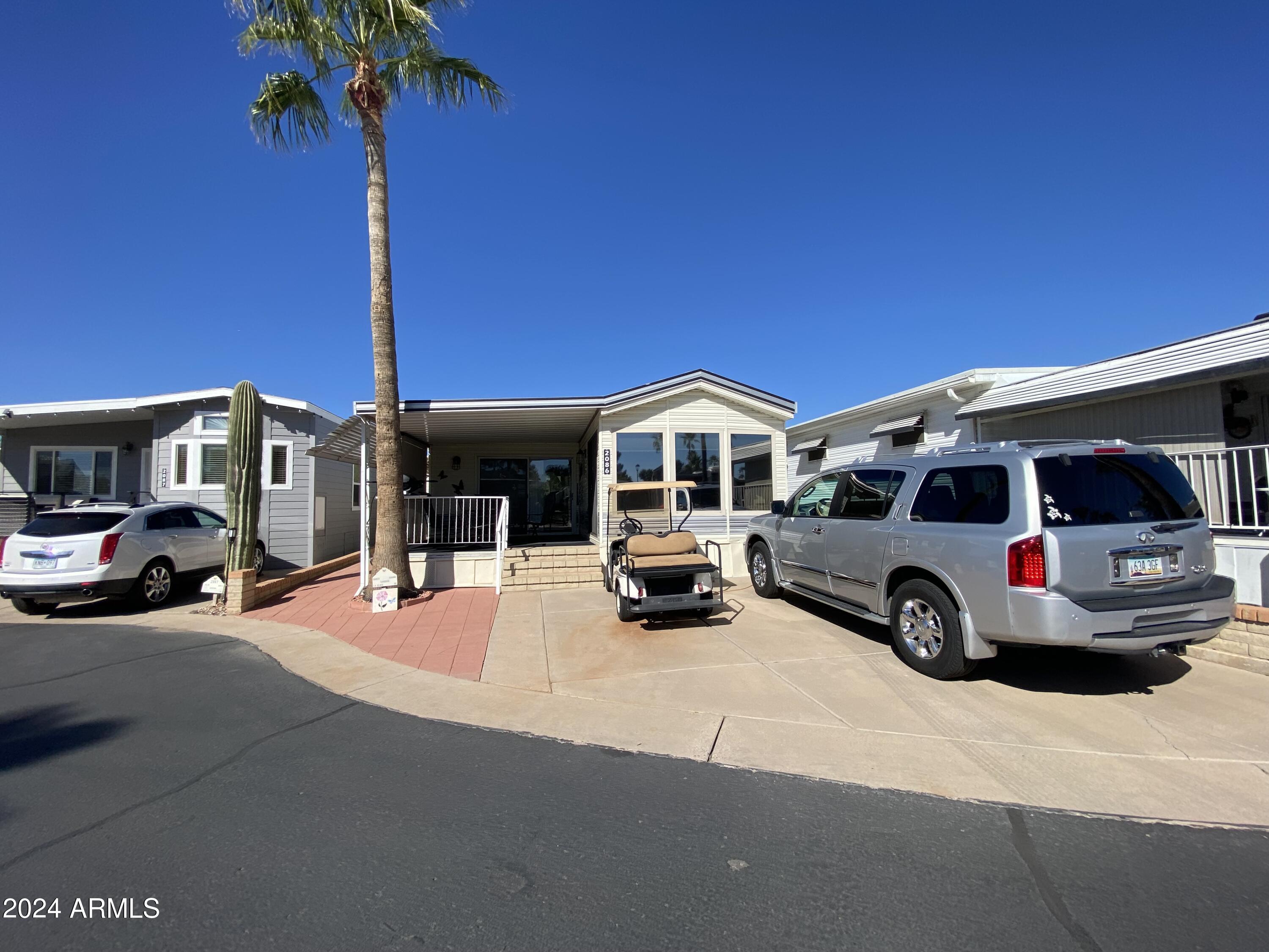 2086 West Klamath Avenue, Unit 86 Apache Junction, AZ 85119 - Photo 17 of 17 a view of a car in front of house