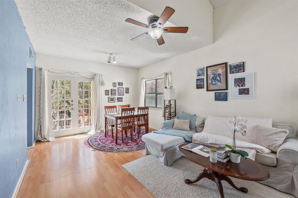 706 West 22nd Street, Unit 201 Austin, TX 78705 - Photo 2 of 11 a living room with furniture and wooden floor