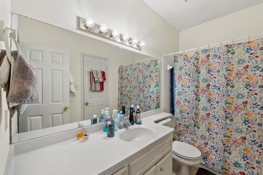 706 West 22nd Street, Unit 201 Austin, TX 78705 - Photo 7 of 11 a bathroom with a sink toilet and shower