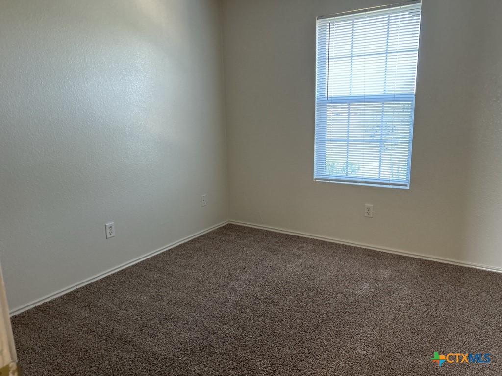 4005 Doraine Court, Unit C Killeen, TX 76549 - Photo 4 of 10 an empty room with a window