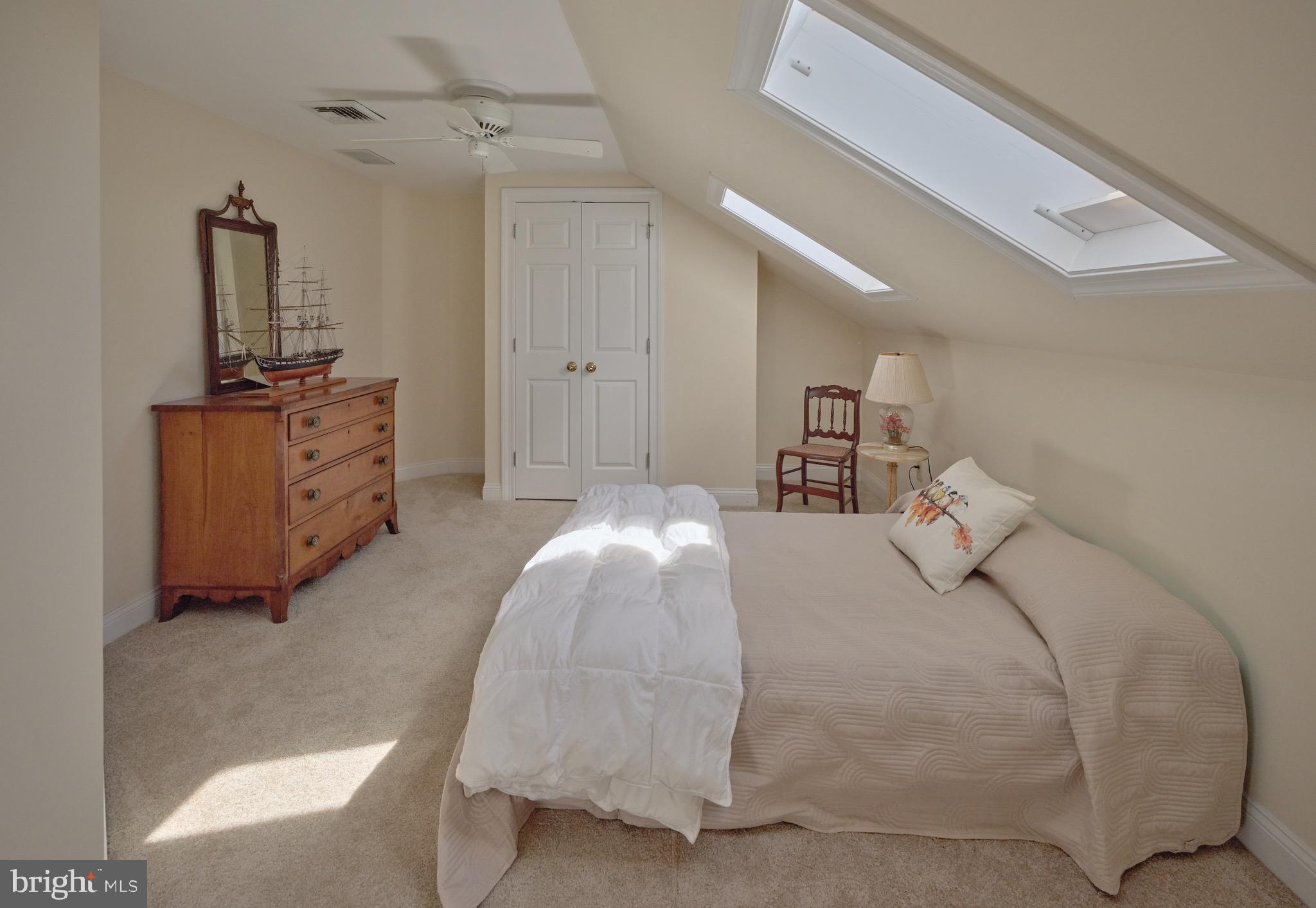 4990 Point Pleasant Pike Doylestown, PA 18902 - Photo 21 of 38 a bedroom with a bed and a chandelier
