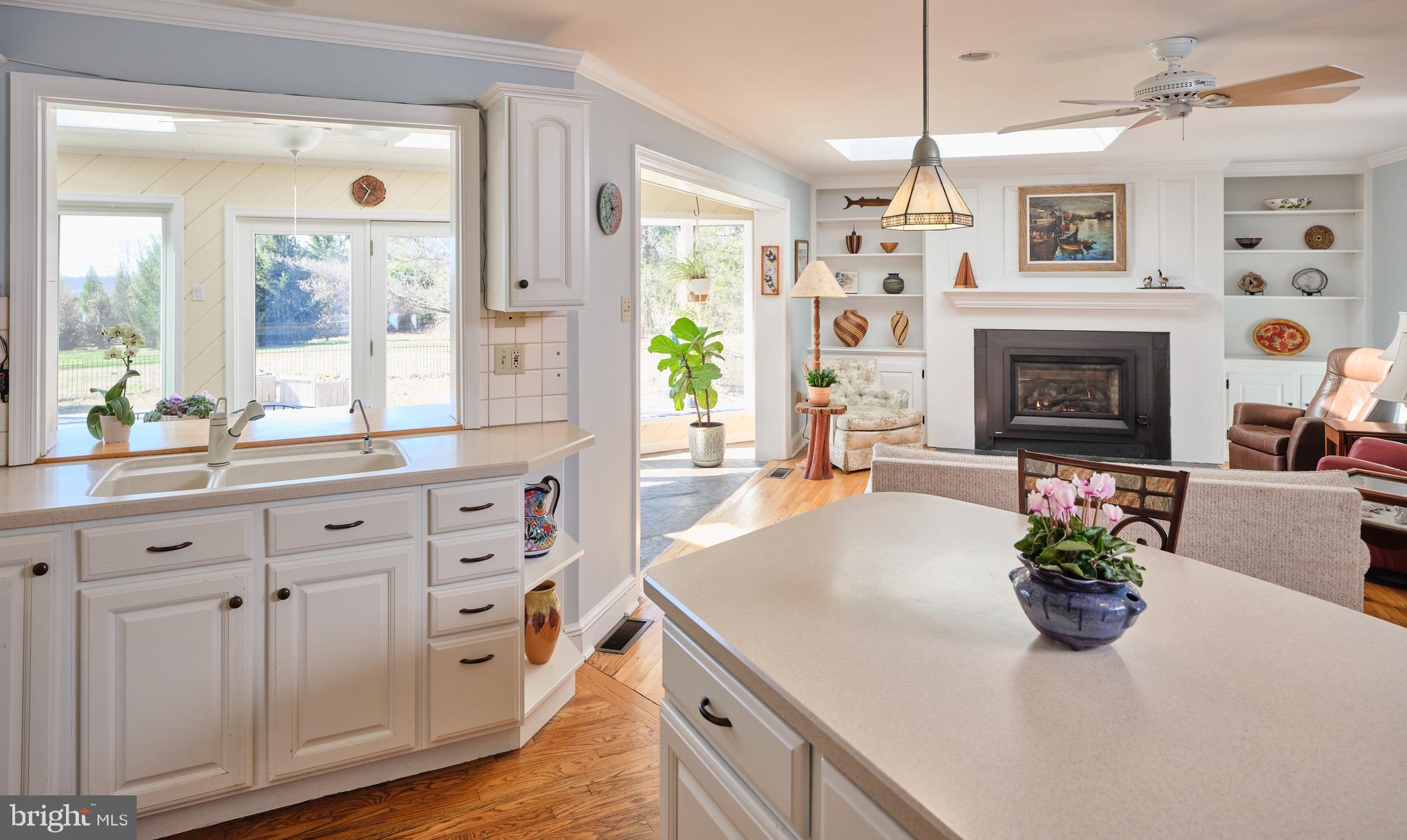 4990 Point Pleasant Pike Doylestown, PA 18902 - Photo 4 of 38 a kitchen with a white cabinets and fireplace