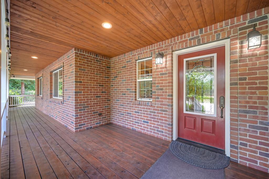 3557 Val Verde Road Loomis, CA 95650 - Photo 3 of 71 a view of a porch with wooden floor and floor to ceiling window