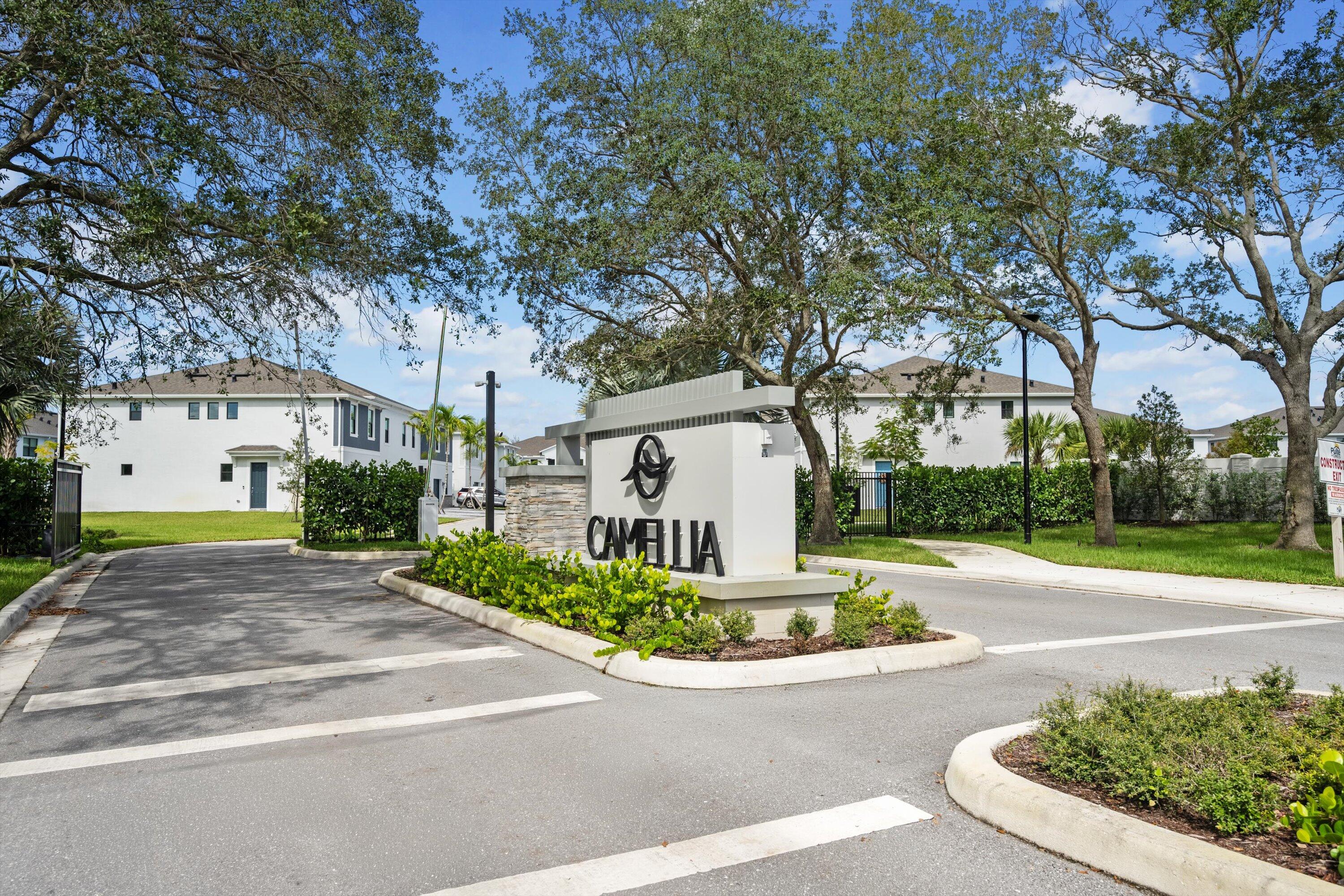 7638 Southwest Lucy Lane Stuart, FL 34997 - Photo 1 of 45 a front view of a house with a yard and a garage