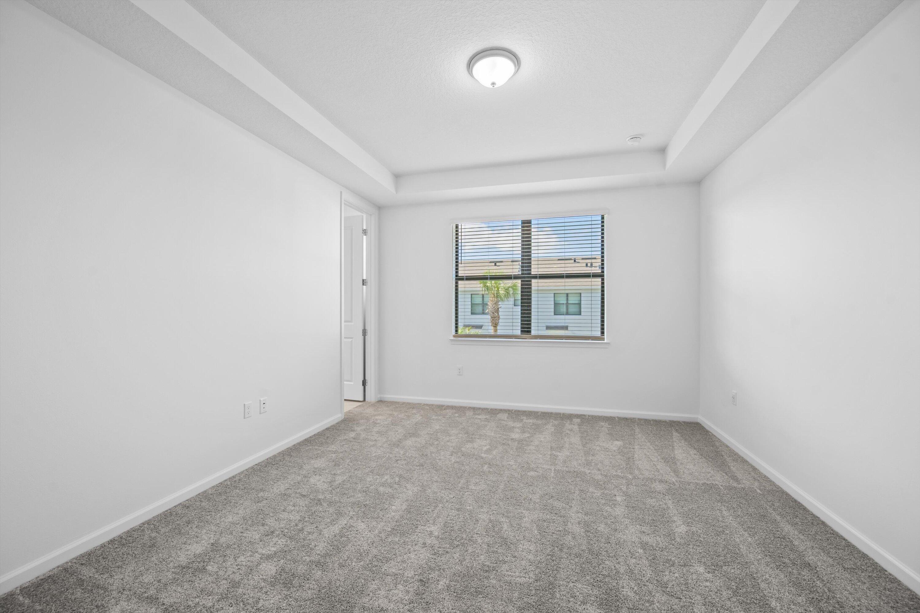 7638 Southwest Lucy Lane Stuart, FL 34997 - Photo 17 of 45 an empty room with windows