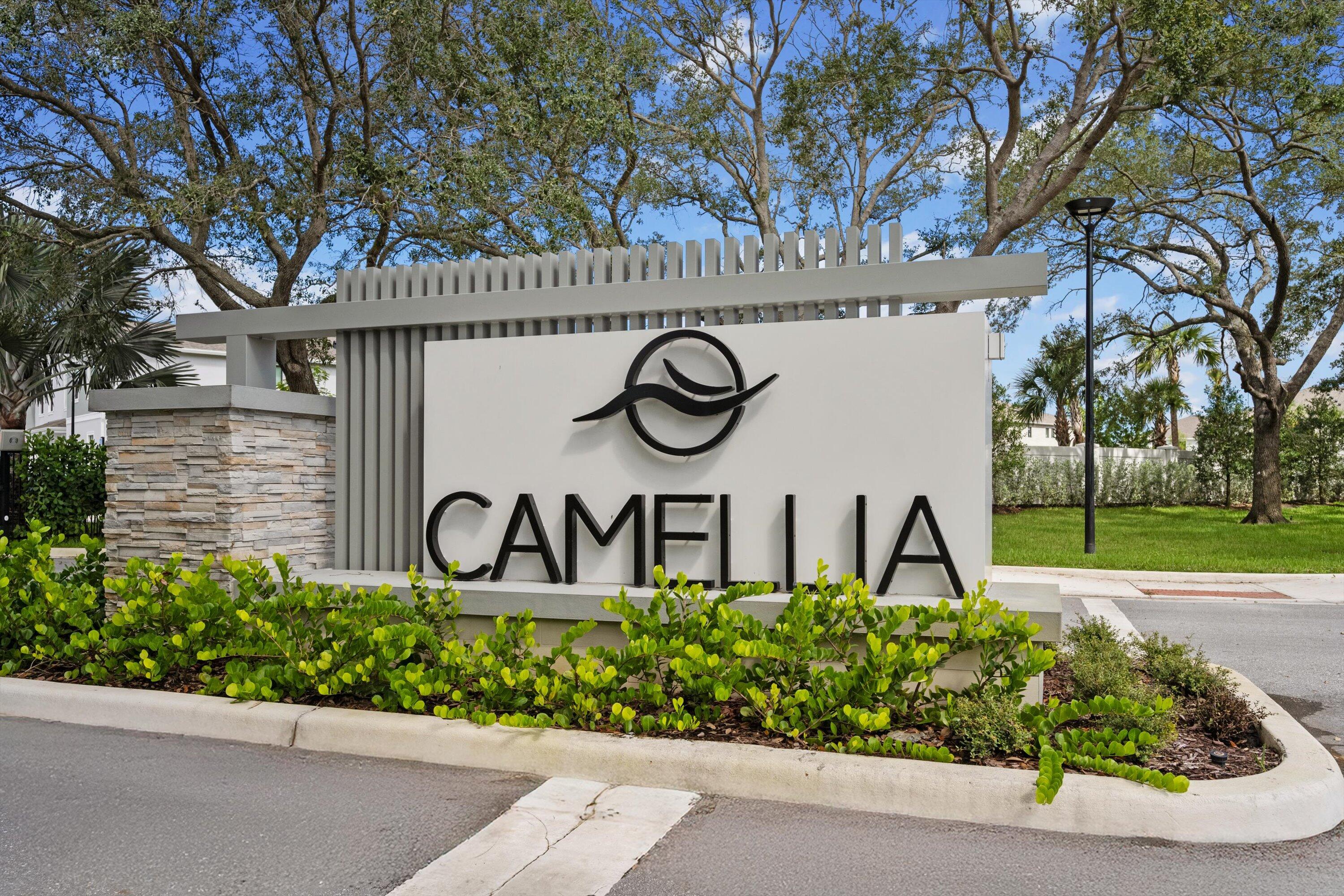 7638 Southwest Lucy Lane Stuart, FL 34997 - Photo 2 of 45 a front view of a house with garden