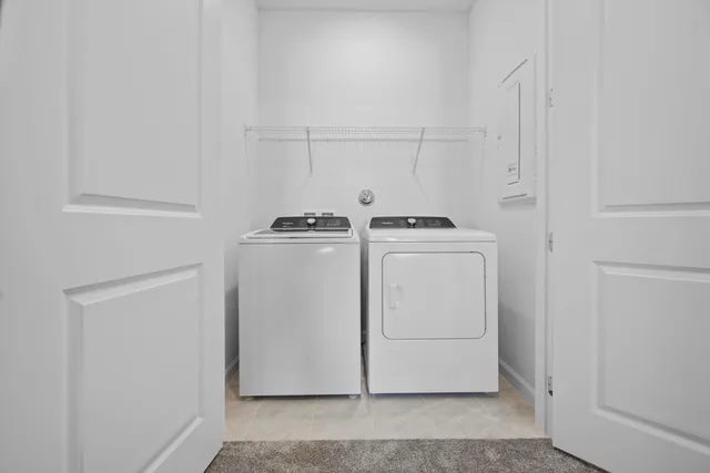 a utility room with dryer and washer