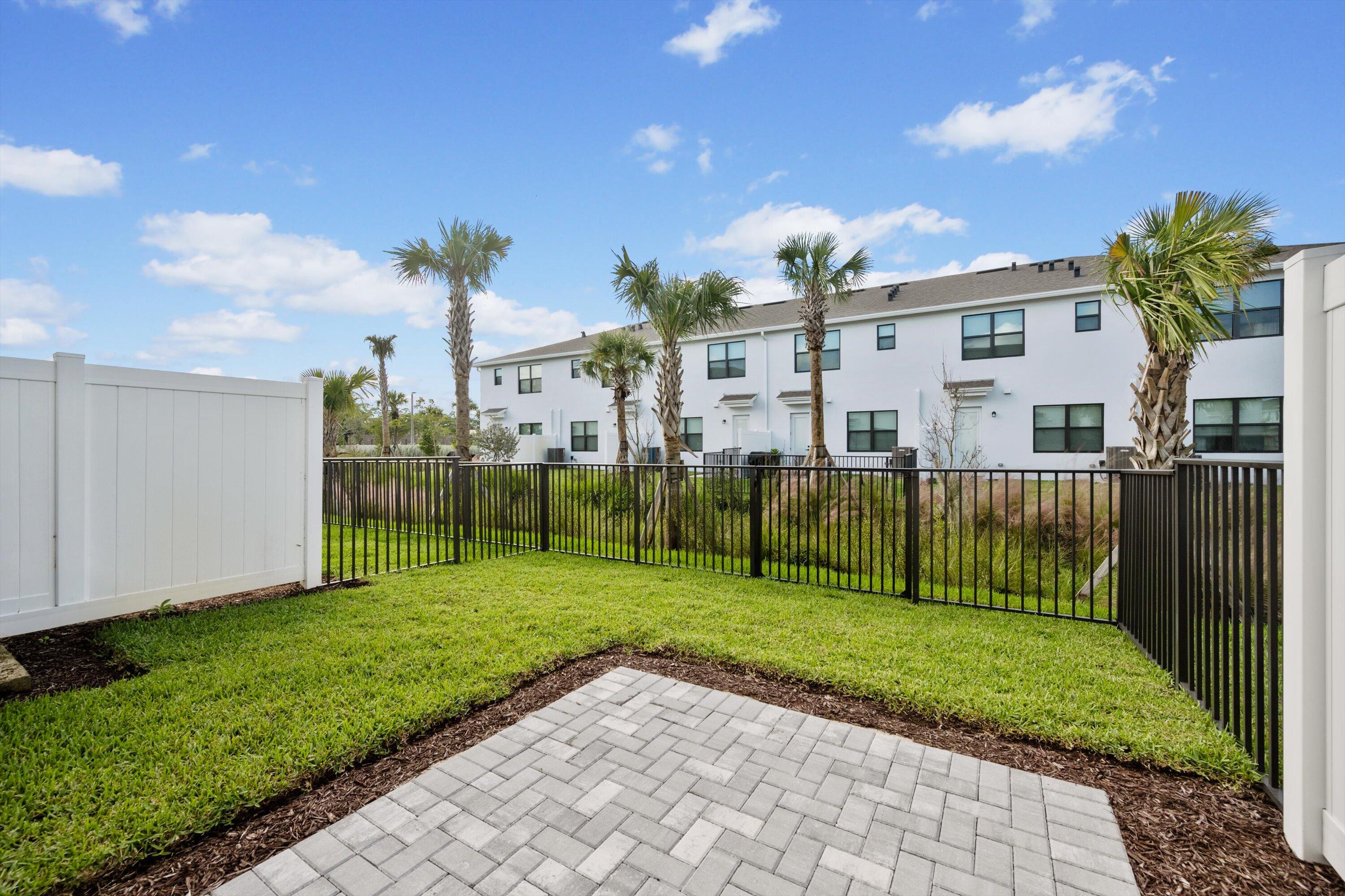 7638 Southwest Lucy Lane Stuart, FL 34997 - Photo 31 of 45 a view of a garden in front of a house