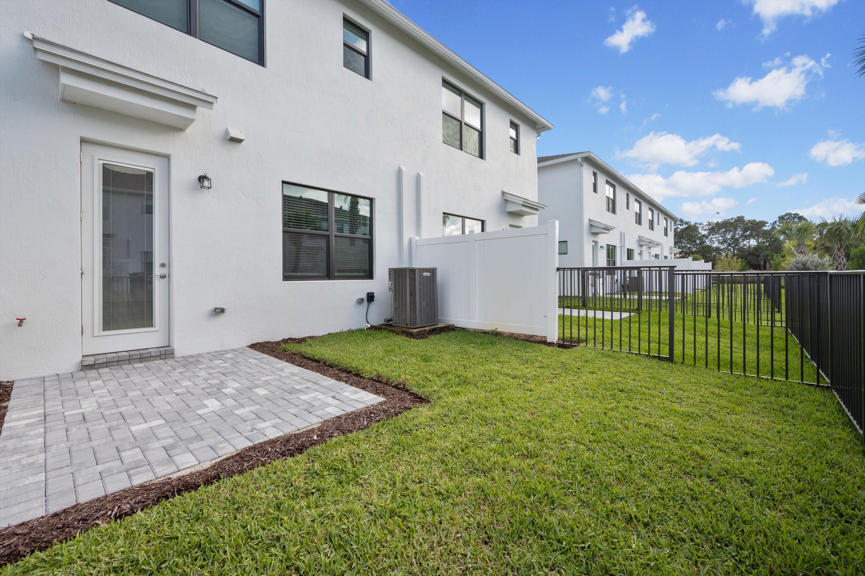 7638 Southwest Lucy Lane Stuart, FL 34997 - Photo 32 of 45 a view of a backyard with a garden