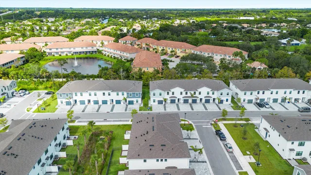 an aerial view of a city with lawn chairs