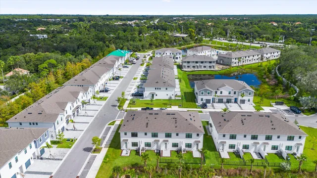 an aerial view of multiple houses with a city