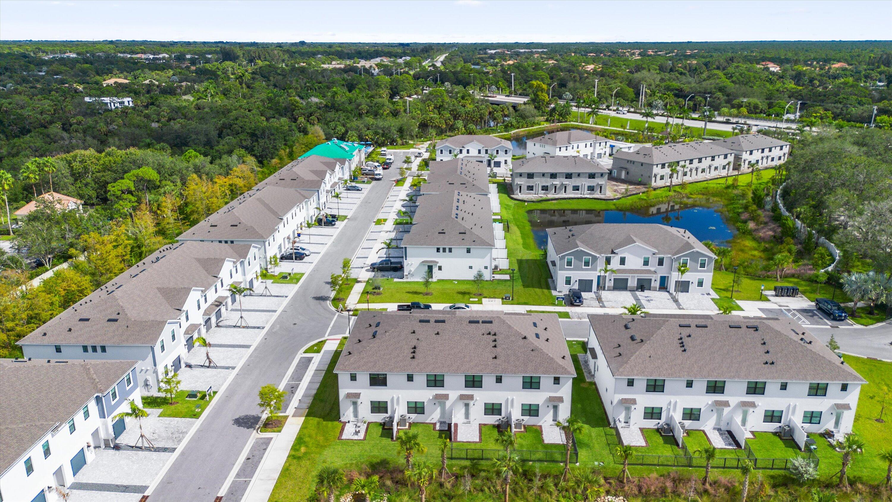 7638 Southwest Lucy Lane Stuart, FL 34997 - Photo 39 of 45 an aerial view of multiple houses with a city