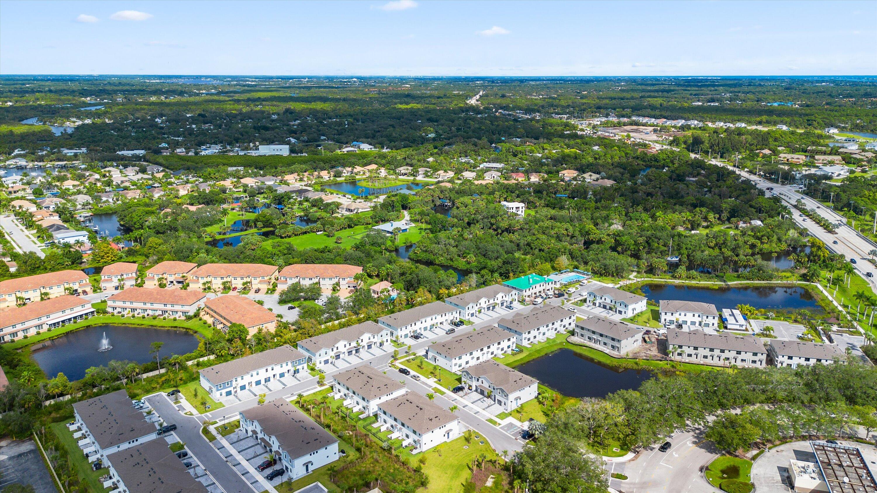 7638 Southwest Lucy Lane Stuart, FL 34997 - Photo 42 of 45 an aerial view of residential houses with outdoor space and trees