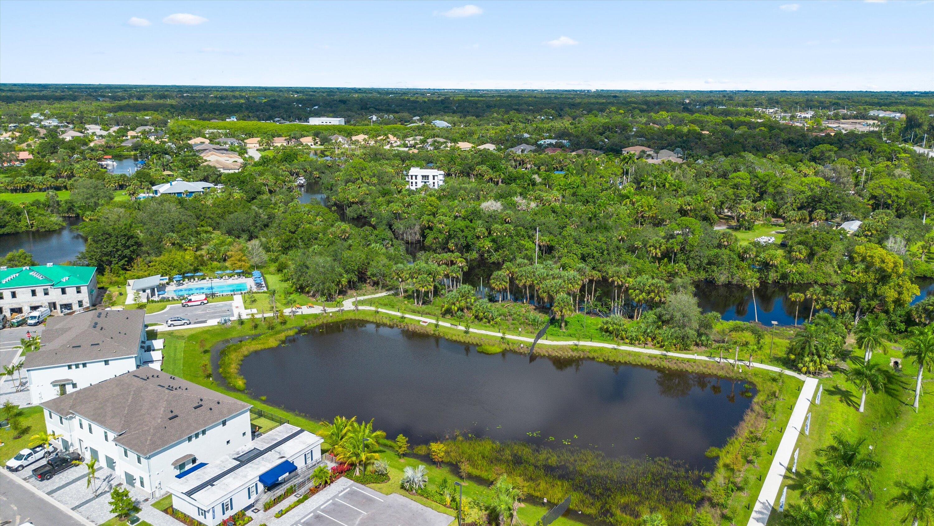 7638 Southwest Lucy Lane Stuart, FL 34997 - Photo 43 of 45 a view of a swimming pool with a yard