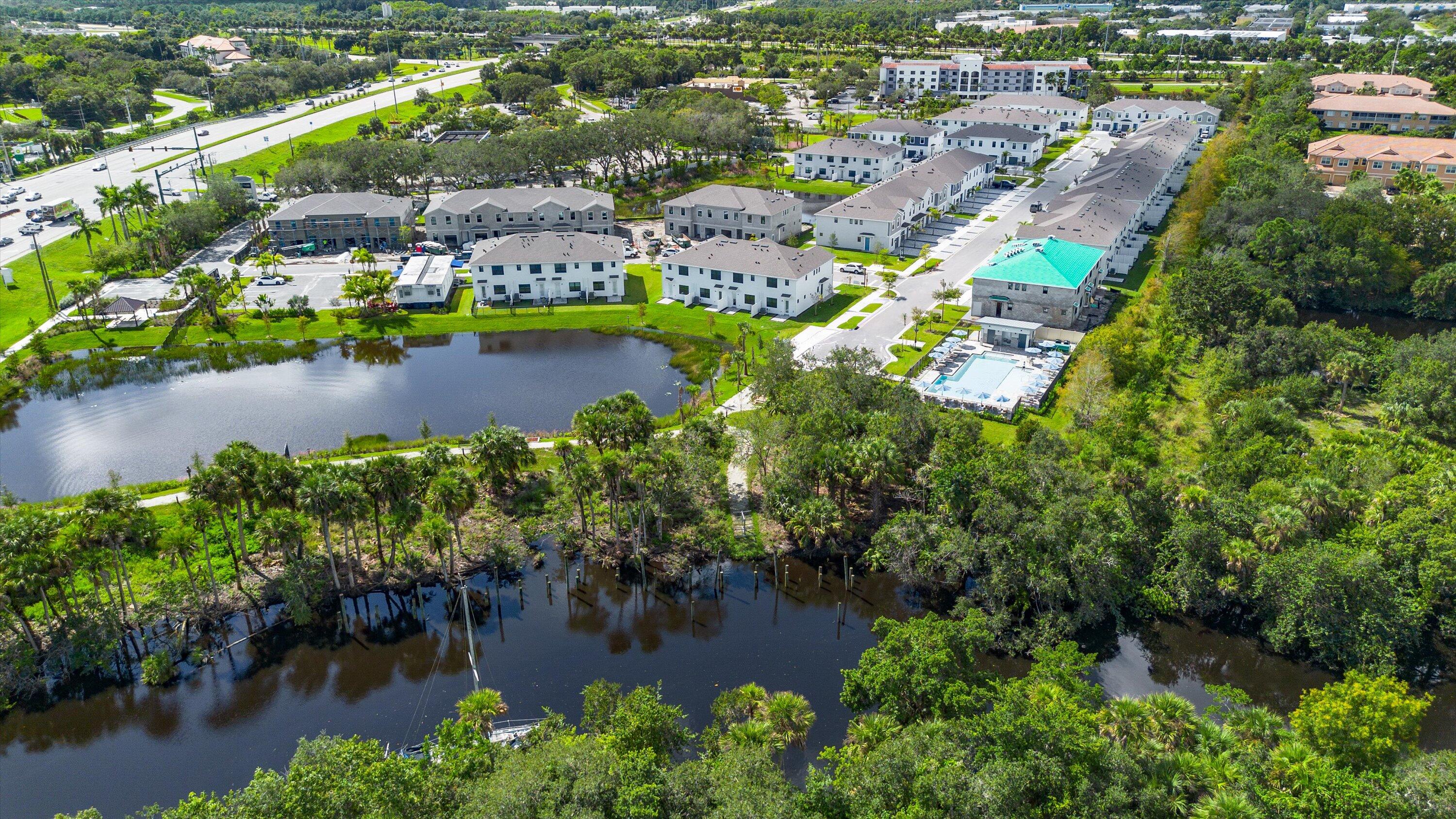 7638 Southwest Lucy Lane Stuart, FL 34997 - Photo 45 of 45 an aerial view of residential houses with outdoor space and lake view