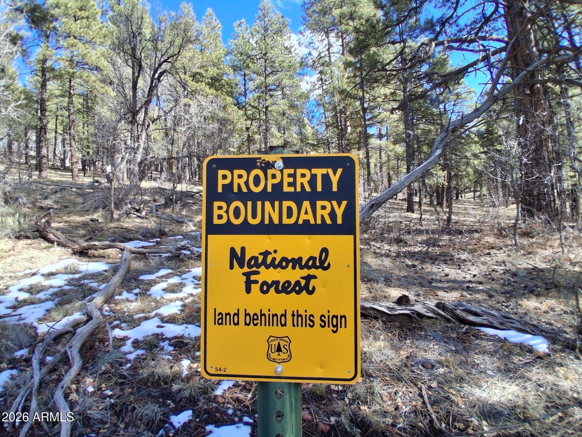 13696 Kings Deer Road Parks, AZ 86018 - Photo 31 of 32 a sign broad on the side of the road