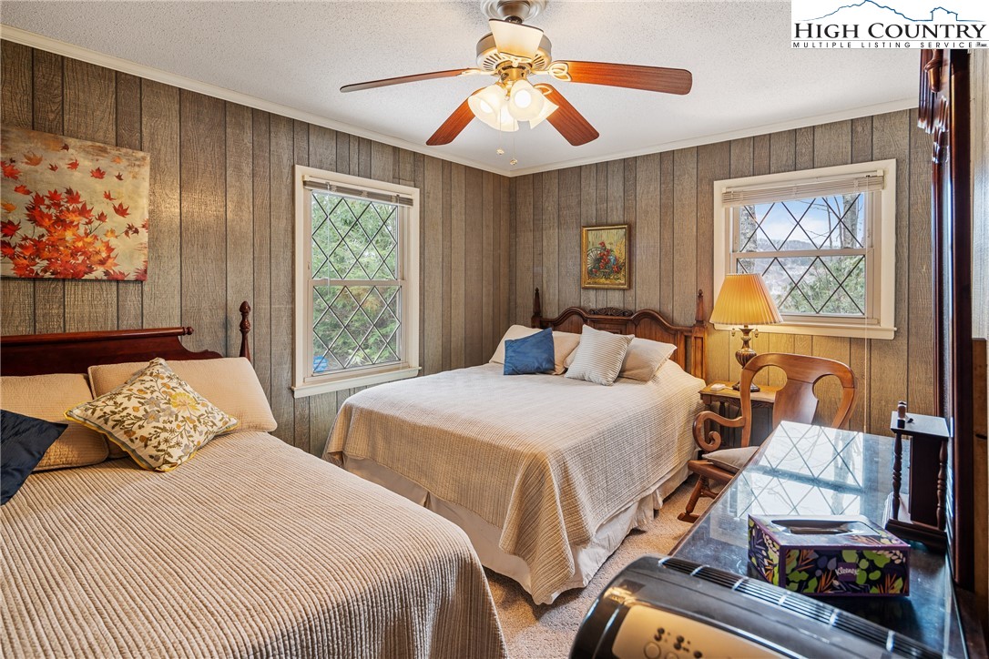 329 Maplewood Circle Boone, NC 28607 - Photo 12 of 46 a bedroom with two beds and a chandelier