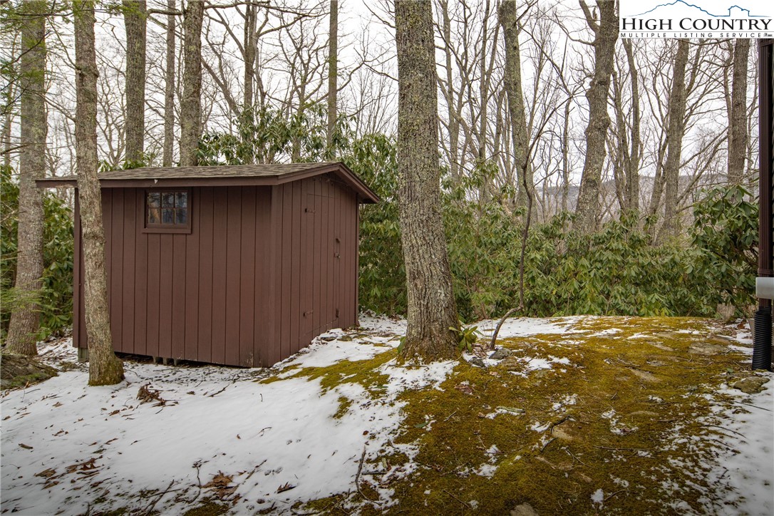 329 Maplewood Circle Boone, NC 28607 - Photo 26 of 46 a backyard of a house with large trees and wooden fence